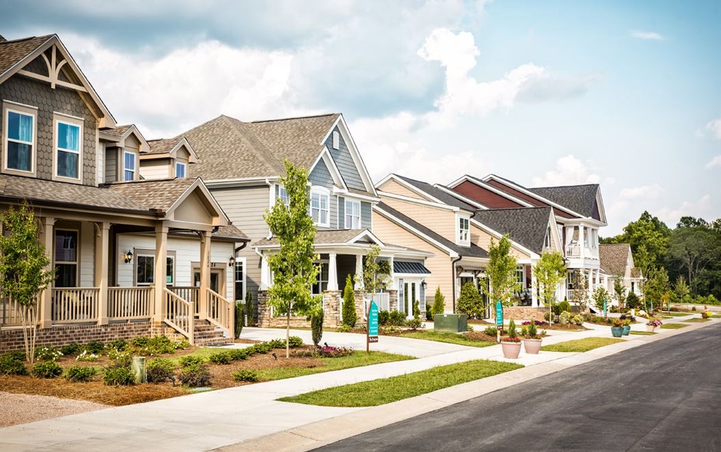 Row of model homes with front covered porches